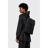 Black Rains mini backpack with sleek, compact design and adjustable shoulder straps, ideal for everyday use.