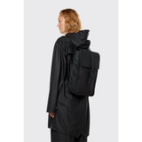 Black Rains Mini Backpack with sleek design, compact size, and adjustable straps, perfect for everyday use.