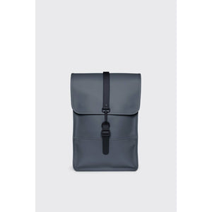 Rains Mini backpack in river blue color, compact design with adjustable straps and front zip pocket, made of waterproof material.