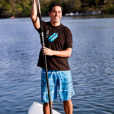 Black SPIbelt money belt with waterproof accessory, designed for secure, hands-free storage during outdoor activities.
