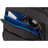 Thule Crossover 2 30L backpack with multiple compartments, black fabric, padded shoulder straps, and front zipper pockets.