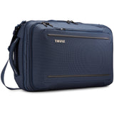 Thule Crossover 2 convertible carry-on luggage with multiple compartments and sturdy wheels for easy travel.
