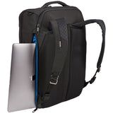 Thule Crossover 2 convertible carry-on luggage with multiple compartments and durable design, shown in a sleek black finish.