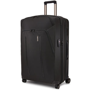 Thule Crossover 2 Carry-On Spinner luggage with four wheels, durable black exterior, and integrated handle for easy travel.