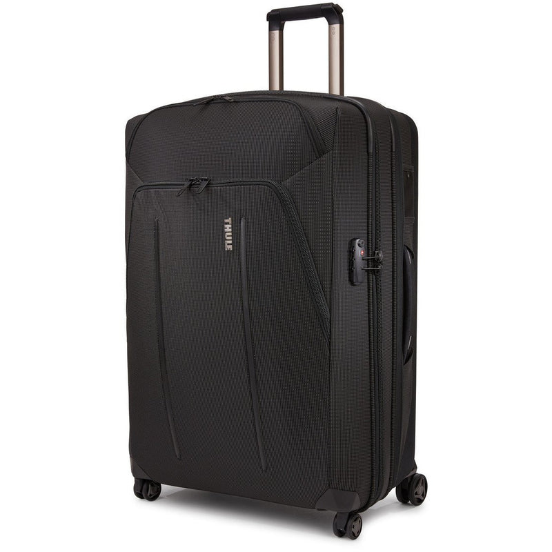 Black Thule Crossover 2 Carry-On Spinner luggage with four wheels and TSA lock for easy travel.
