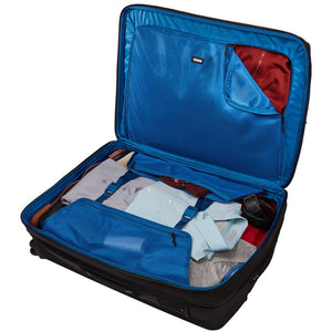 Thule Crossover 2 Carry On Spinner luggage with four wheels, hard-shell exterior, and telescoping handle for easy travel.