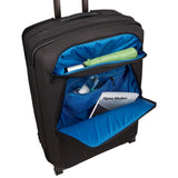 Black Thule Crossover 2 carry-on spinner luggage with four wheels and telescoping handle, designed for easy travel.