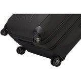 Black Thule Crossover 2 Carry-On Spinner luggage with four wheels and telescopic handle, designed for travel convenience.