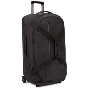 Thule Crossover 2 Wheeled Duffel 30-inch luggage with durable fabric, retractable handle, and wheels for easy travel.
