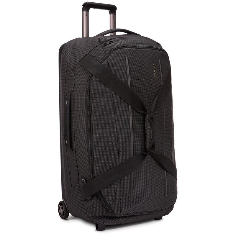 Thule Crossover 2 Wheeled Duffel 30-inch luggage with durable fabric, retractable handle, and wheels for easy travel.