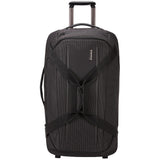 Thule Crossover 2 Wheeled Duffel 30-inch luggage with durable fabric, retractable handle, and wheels for easy travel.