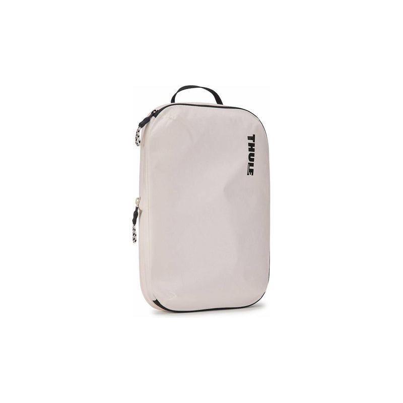 Medium Thule compression packing cube used for organizing clothes and accessories in luggage or travel bags.