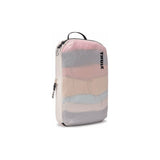Medium Thule compression packing cube for organizing clothes and essentials during travel. Durable, space-saving packing organizer.