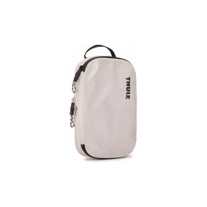 Small Thule compression packing cube for organized packing, featuring durable fabric and multiple compartments.