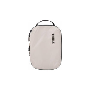 Small Thule compression packing cube for organizing clothing and essentials, made of durable materials for travel and storage.