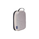 Small Thule compression packing cube for organized travel storage, made of durable packing organizers material.