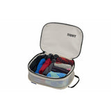 Small Thule compression packing cube for travel organization, showcasing durable fabric and compact design for efficient packing.