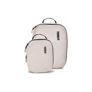 Thule Compression Cube Set of packing organizers for efficient travel storage, featuring multiple compression cubes in various sizes.