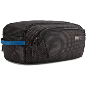 Thule Crossover 2 toiletry bag with multiple compartments and durable fabric, designed for organized travel storage.