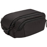 Thule Crossover 2 toiletry kit with multiple compartments and durable black fabric, designed for travel organization.