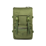 Olive green Topo Designs Rover Pack Tech backpack with padded shoulder straps and multiple compartments, outdoor gear style.