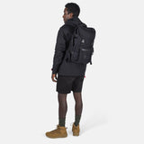 Topo Designs Rover Pack Tech backpack with multiple compartments, padded shoulder straps, and durable fabric for outdoor use.