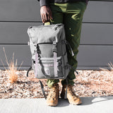 Light gray Topo Designs Rover Pack Tech backpack with adjustable straps and multiple compartments, shown on a plain background.
