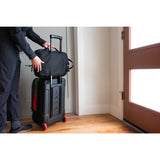 Topo Designs Global Travel Bag Roller carry-on luggage with durable fabric and multi-pocket design for organized travel.