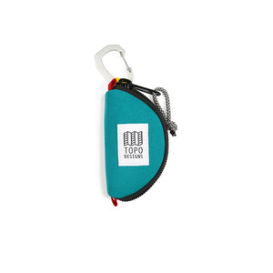 Turquoise Topo Designs Taco Bag packing organizer with multiple compartments for travel and gear organization.