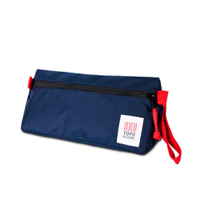Topo Designs Dopp Kit toiletry bag with zipper closure and leather logo patch, compact and durable for travel storage.