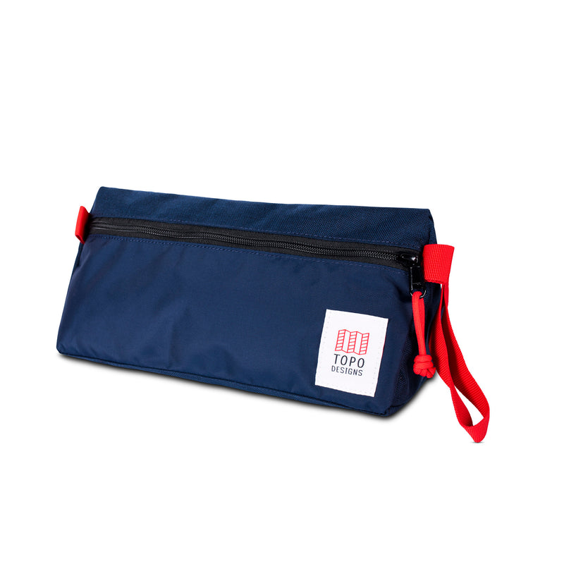 Topo Designs Dopp Kit toiletry bag with zipper closure and leather logo patch, compact and durable for travel storage.