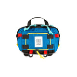 Topo Designs Subalpine Hip Pack in blue and black ripstop fabric, versatile waist pack with adjustable straps and multiple compartments.