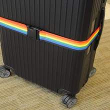 Blue adjustable luggage strap from Voltage Valet, a travel essential for securing and organizing suitcases during trips.