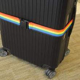 Blue adjustable luggage strap from Voltage Valet, a travel essential for securing and organizing suitcases during trips.